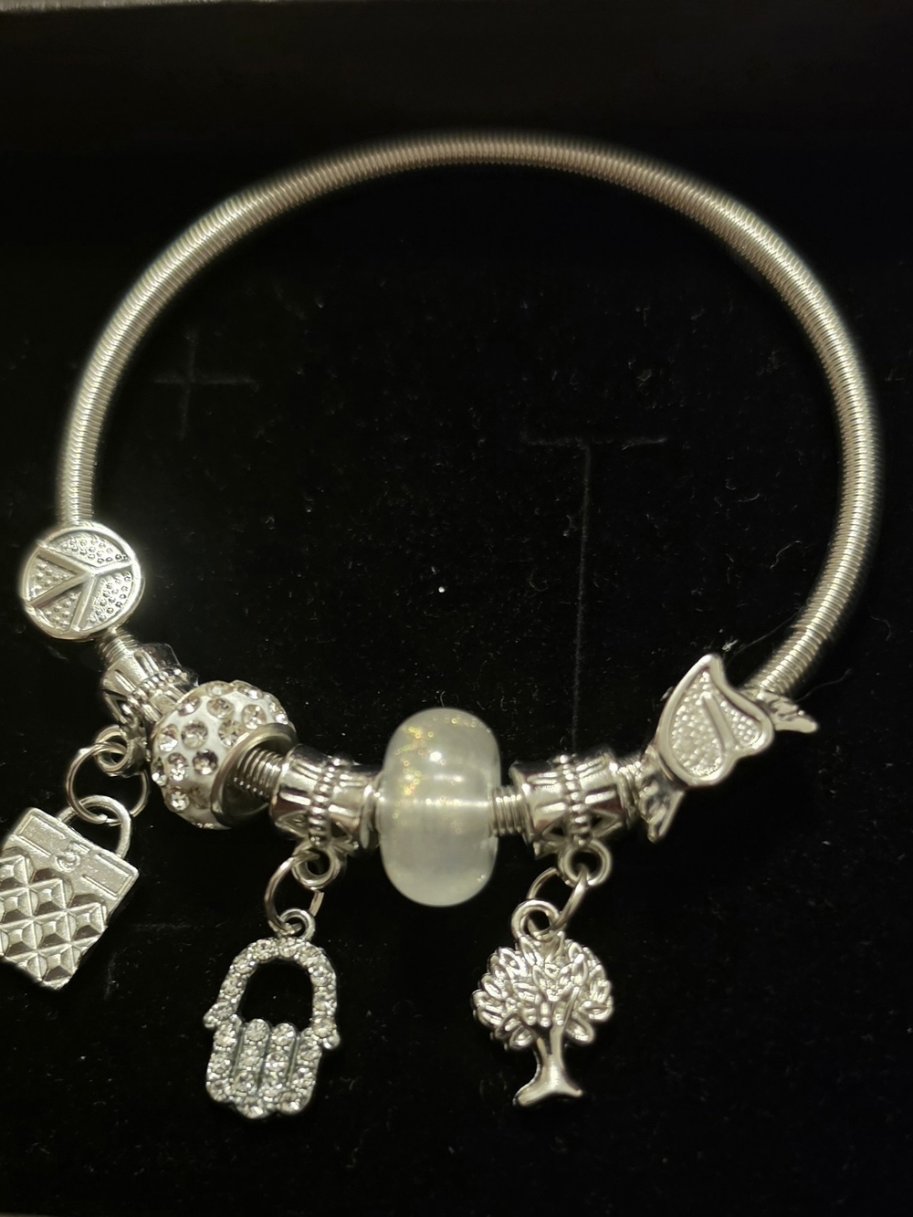Silver Charm Bracelet with White Opalescent Bead and Hanging Charms